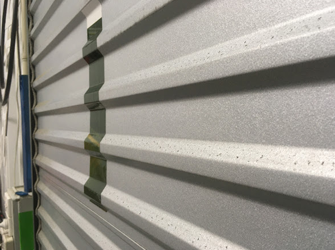 metal-roller-shutter-door-vinyl-wrapped-cast